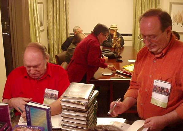 Mike Resnick and Eric Flint signing books