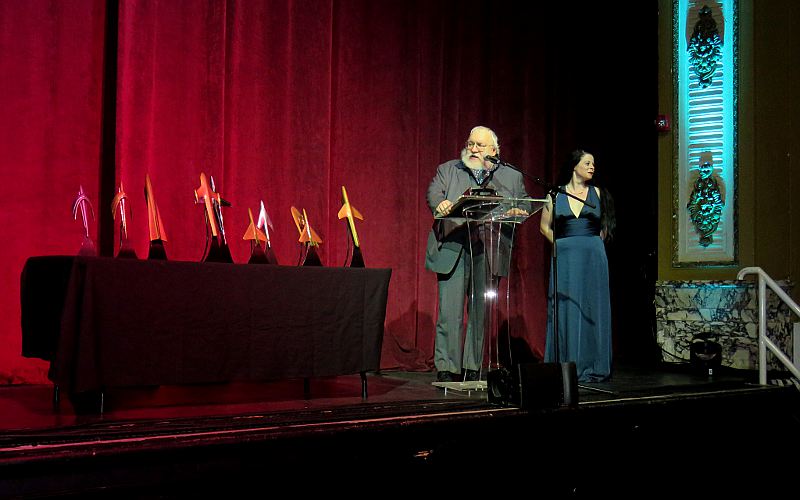 George R. R. Martin and Alfie Awards on stage